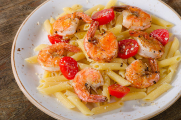 Pasta with shrimps and tomatoes.