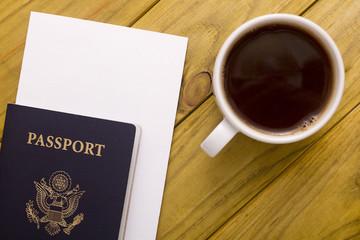 Documents for travel and a cup of coffee