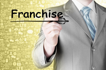 business man writing franchise