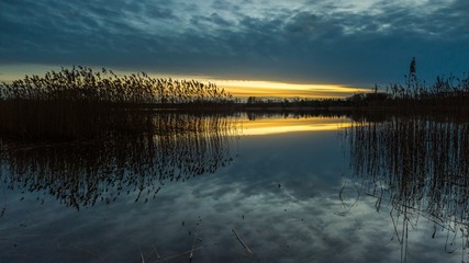 Beautiful sunset over calm lake