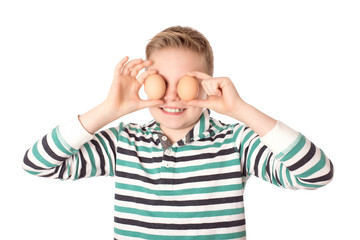 Young boy play the eggs over the white