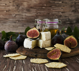 figs with cheese and honey , selective focus