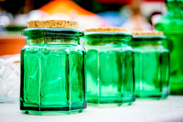Small green glass jars with corks