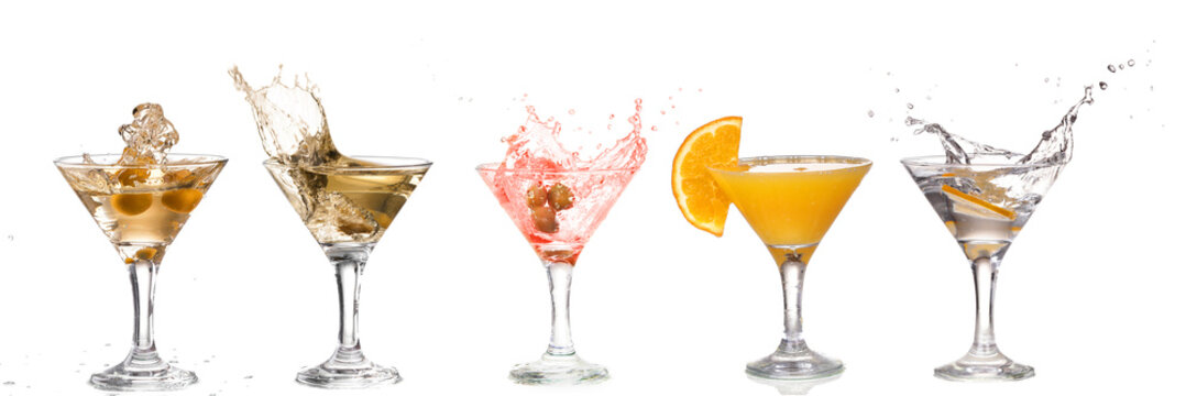 A martini glass on a white background; alcohol cocktail set with splash isolated on white; horizontal format