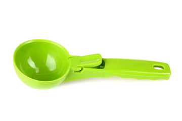 Green ice cream scoop on white isolated background