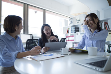 Three women have a fun meeting