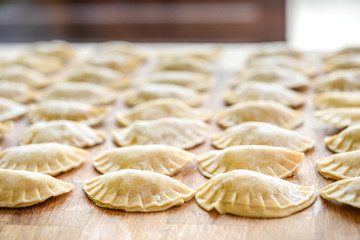 Making of homemade dumplings pastry tortellini or ravioli