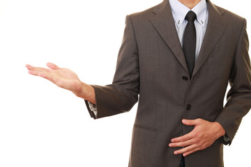 Obraz premium 案内するビジネスマン