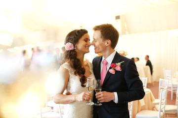 Lovely grooms holding each other