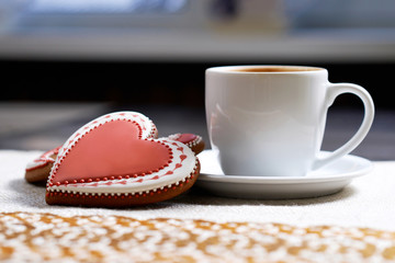 Baked with love. Closeup shot of a Valentine’s day cup of coffee with cookies