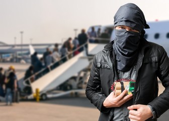 Terrorist has dynamite bomb in jacket in airport. Terrorism concept.