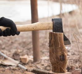 the man's hand chopping wood
