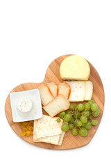 cheese with cookies, grapes on white background isolated