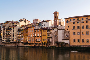 Fototapeta na wymiar View on the old Florence houses from the Ponte Vecchio over Arno river in Florence, Tuscany, Italy