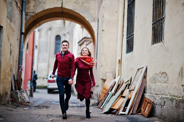 Young beautiful stylish fashion couple in a red dress in love st