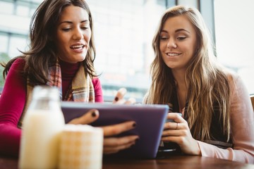 Friends using tablet together