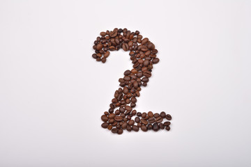Number two from coffee beans isolated on white background. Love