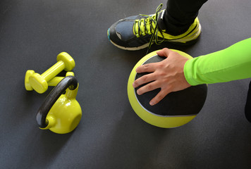 man training with kettlebell and medicine ball