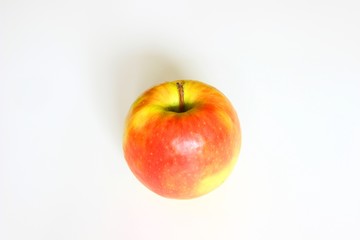 Apple on white table