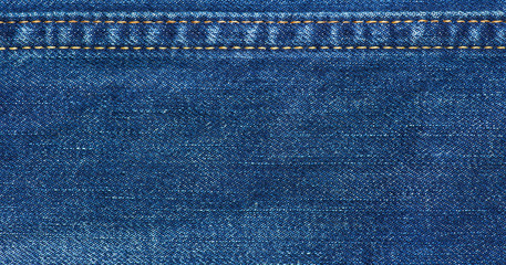 Jeans texture with seam - obrazy, fototapety, plakaty