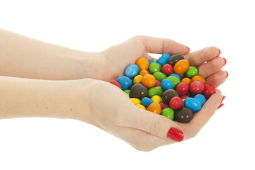 Colorful candy in hands