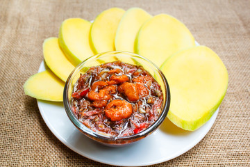 Mango with a sweet sauce and prawn.