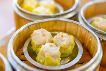 Siu Mai / Dim sum - Chinese steamed pork dumplings in bamboo ste