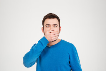 Obraz premium Man covering mouth with palm