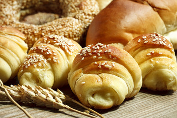 fresh croissants on a wooden board