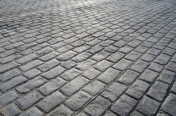 Fototapeta premium old road paved with granite stones
