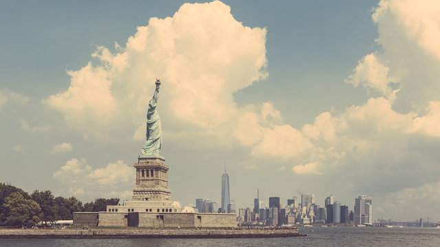 Statue of Liberty with New York skyline on background
