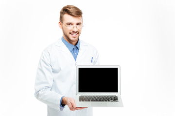 Male doctor showing blank laptop computer screen