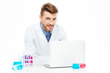 Chemist using laptop computer