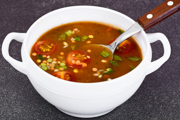 Spicy soup with curry, chili, cereals, rice and vegetables.