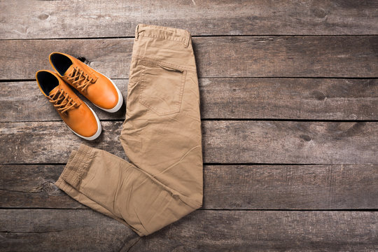 Men's clothes on wooden background