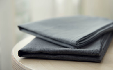grey towels pile isolated on wooden background