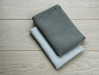 grey towels pile isolated on wooden background