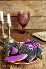 Creative Halloween cookies on wooden background