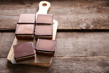 Delicious chocolate brownies on wooden background