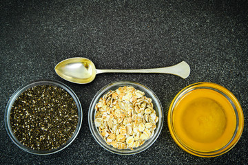 Chia Seeds, Oatmeal, Honey in Glass Bowl