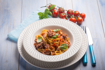 tagliolini with squid and fresh tomatoes
