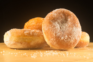 Donuts on black background.
