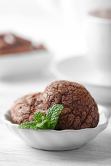 Chocolate chip cookie in plate with mint, closeup