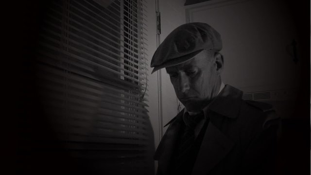 An old film noir gangster waiting for someone