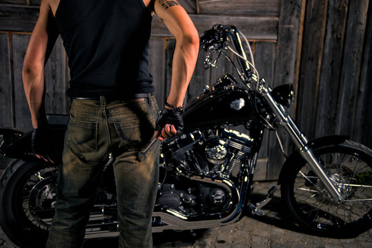 Young Man With Wrench, Ready To Repair His Bike