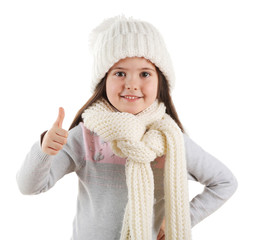 Happy little girl in a trendy knitted clothes, isolated on white