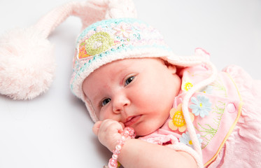 A cute newborn little baby girl. Use it for a child, parenting or love concept.