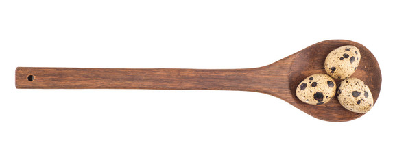 Food: group of quail eggs on wooden spoon isolated on white back