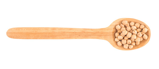 uncooked chickpeas in wooden spoon on white background