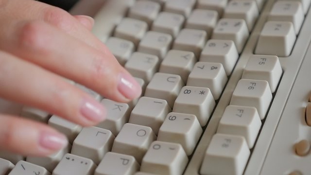 Woman typing on computer keyboard slow motion 1080p HD footage - Slow motion typing on PC beige keyboard close up 1920X1080 FullHD video 